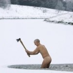 Man Chopping Through Frozen Lake Ice